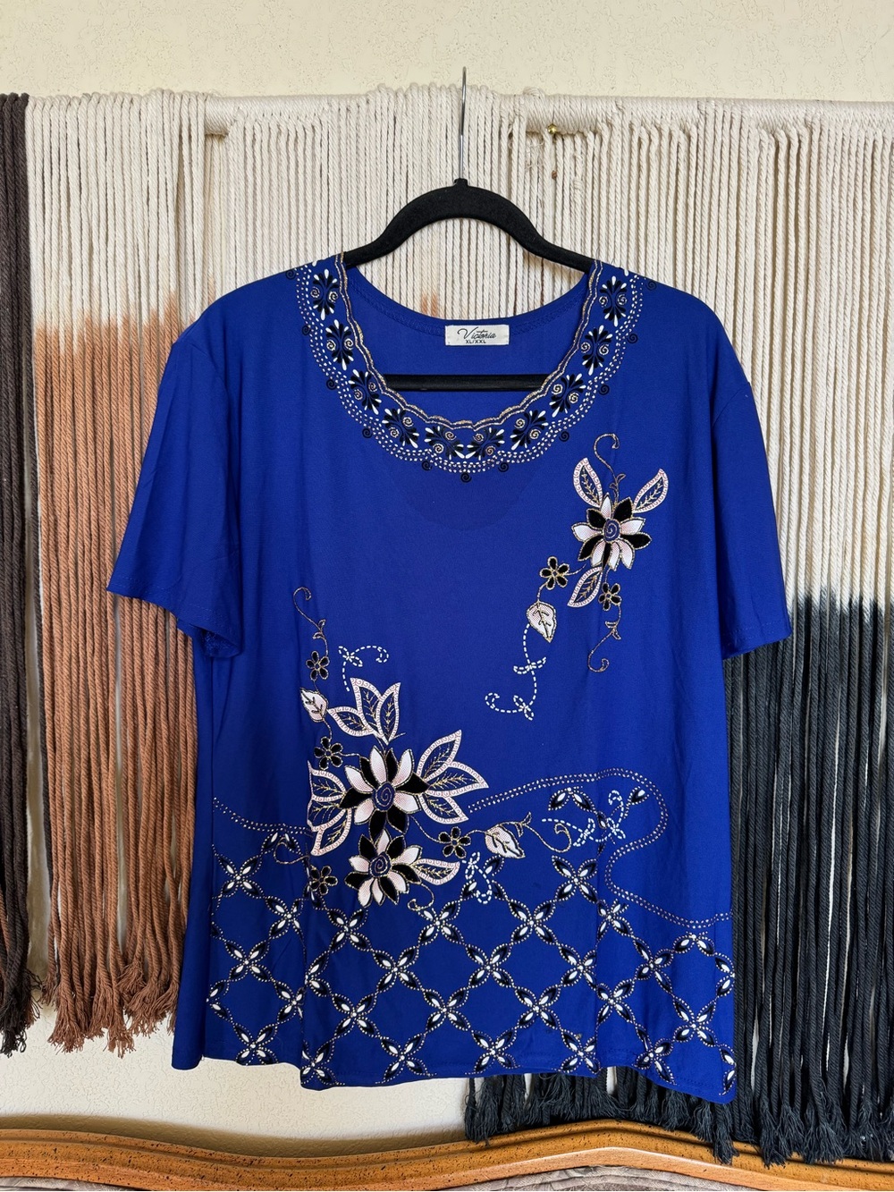Blue floral Victoria shimmer blouse with short sleeves and a scallop neckline